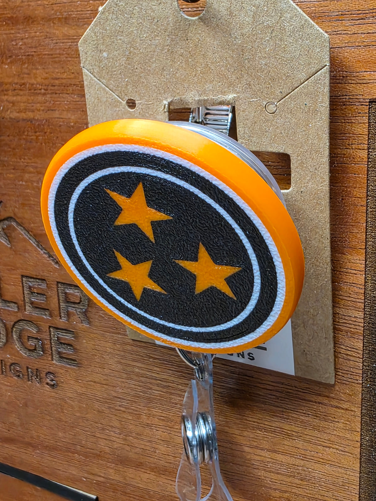 Dark Mode Tristar badge reel