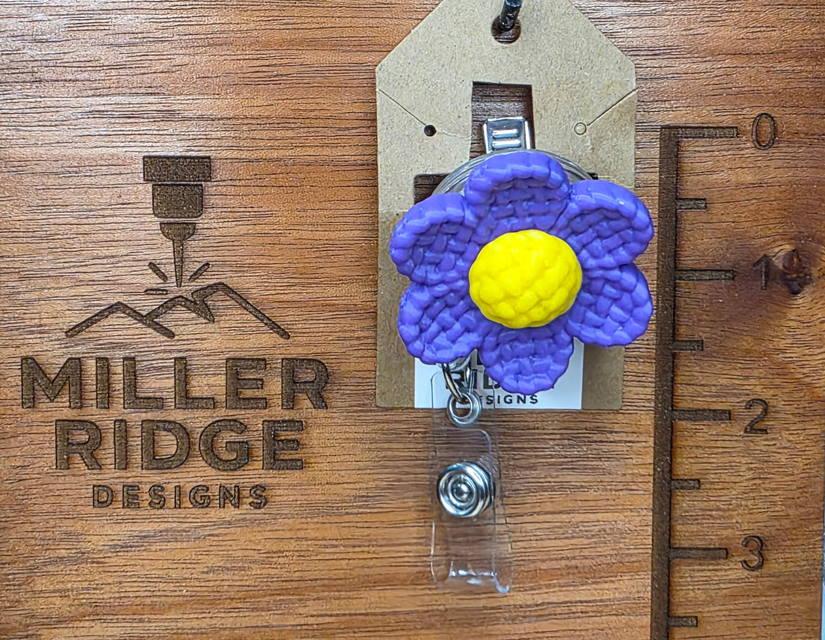 Purple daisy badge reel