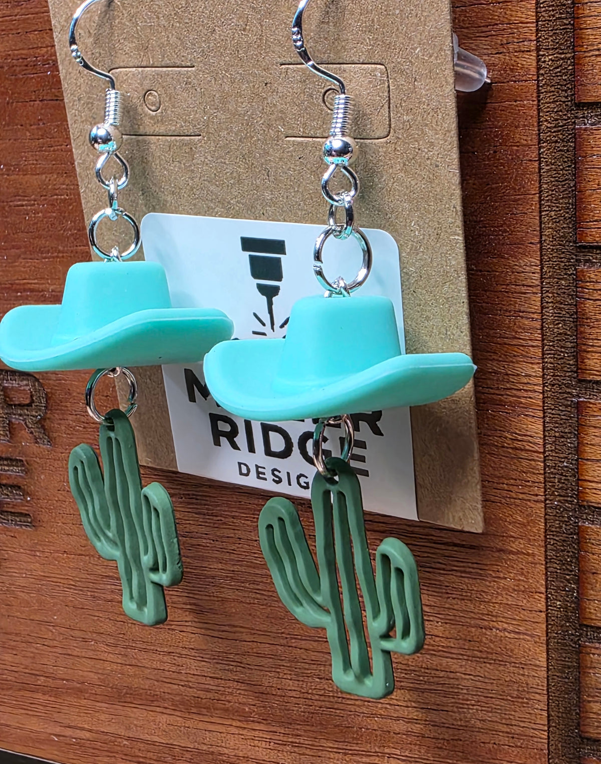 Teal cowboy hat and cactus