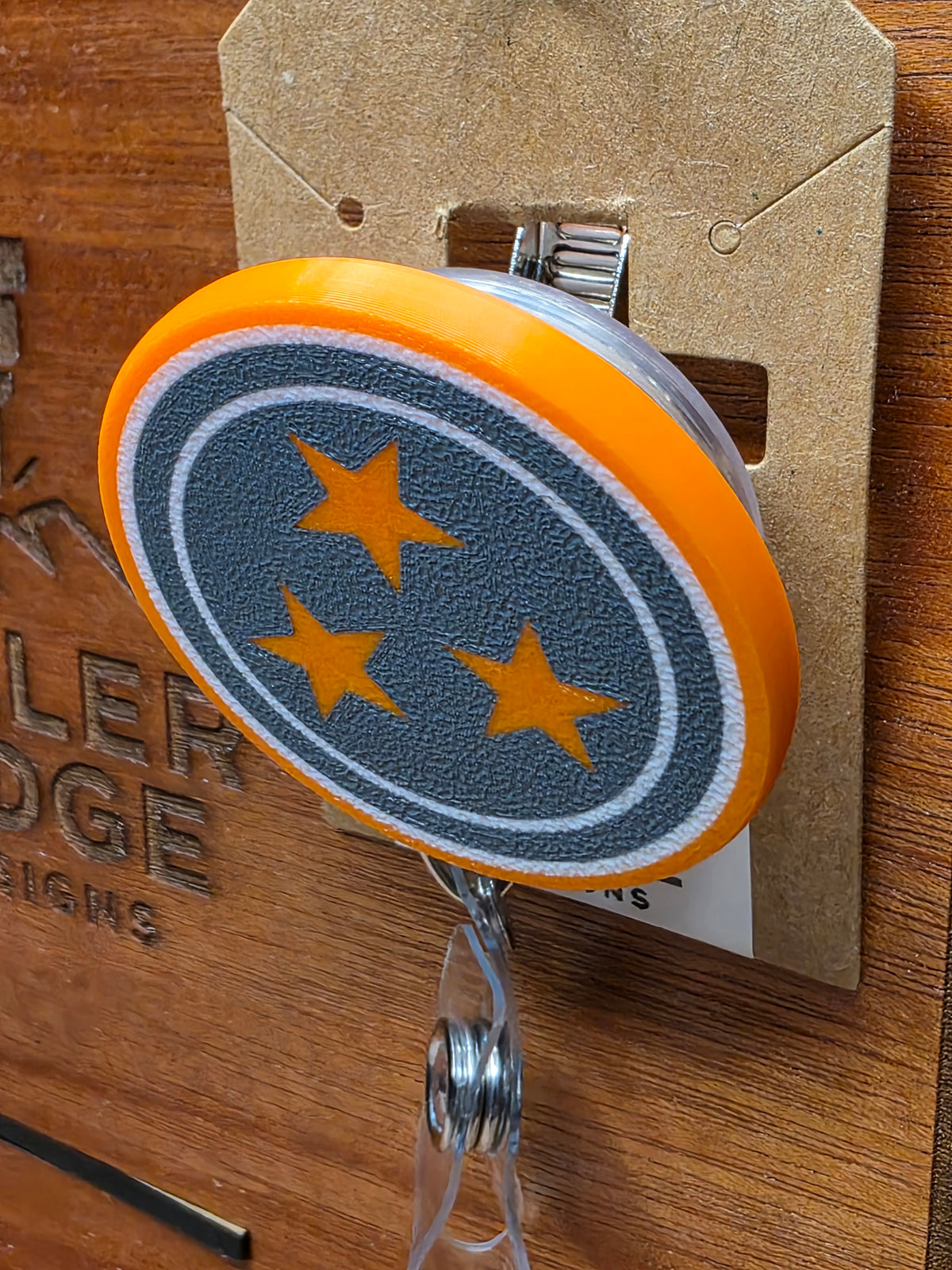 Smokey grey Tristar badge reel