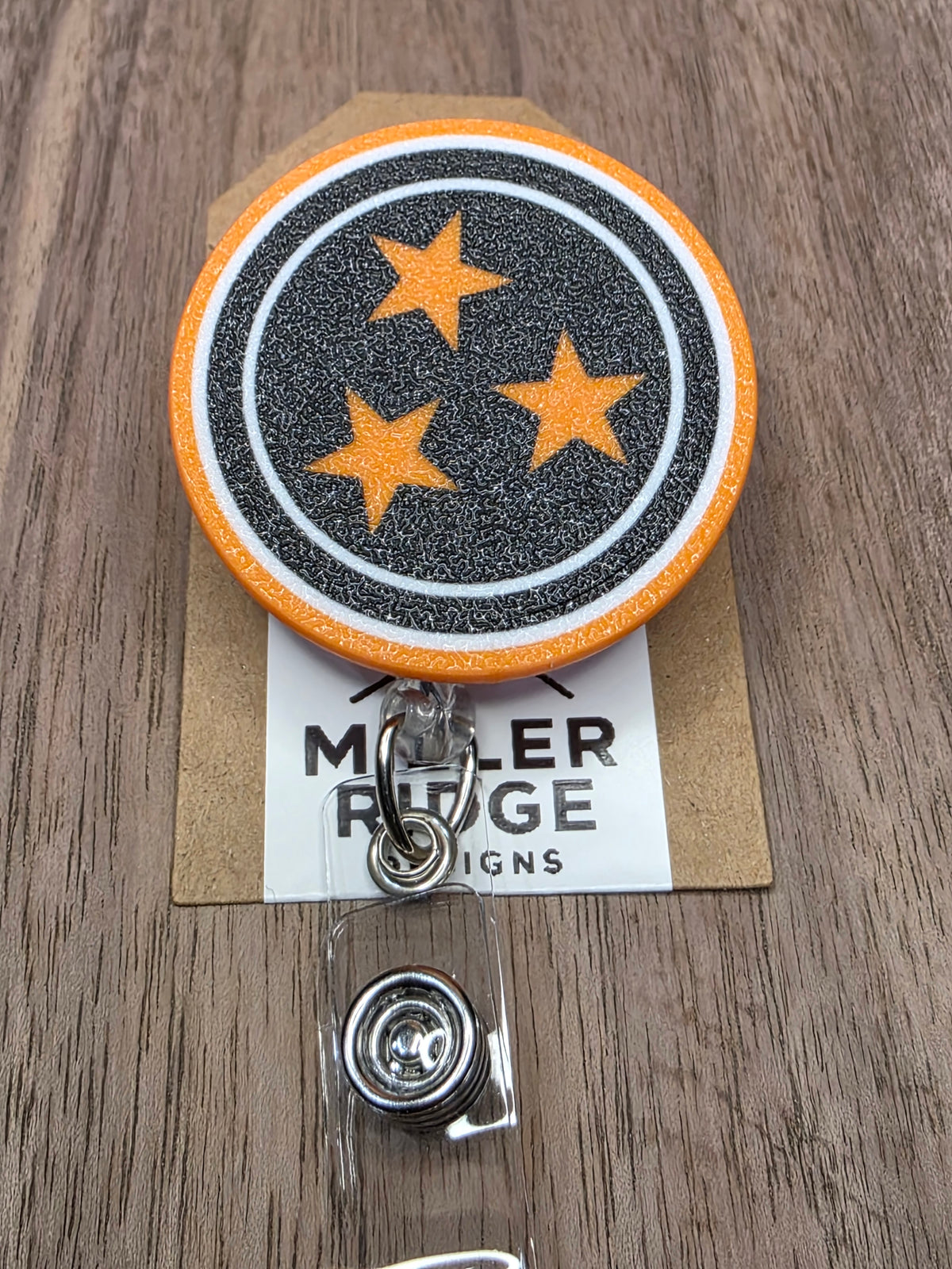 Dark Mode Tristar badge reel