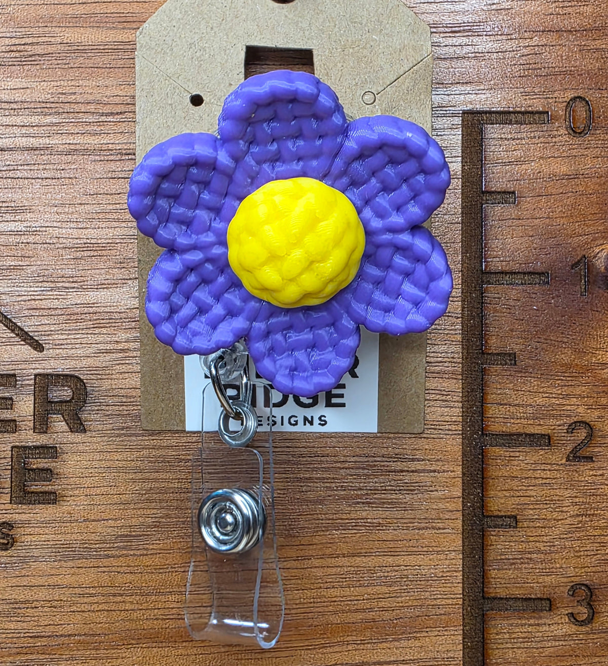 Purple daisy badge reel