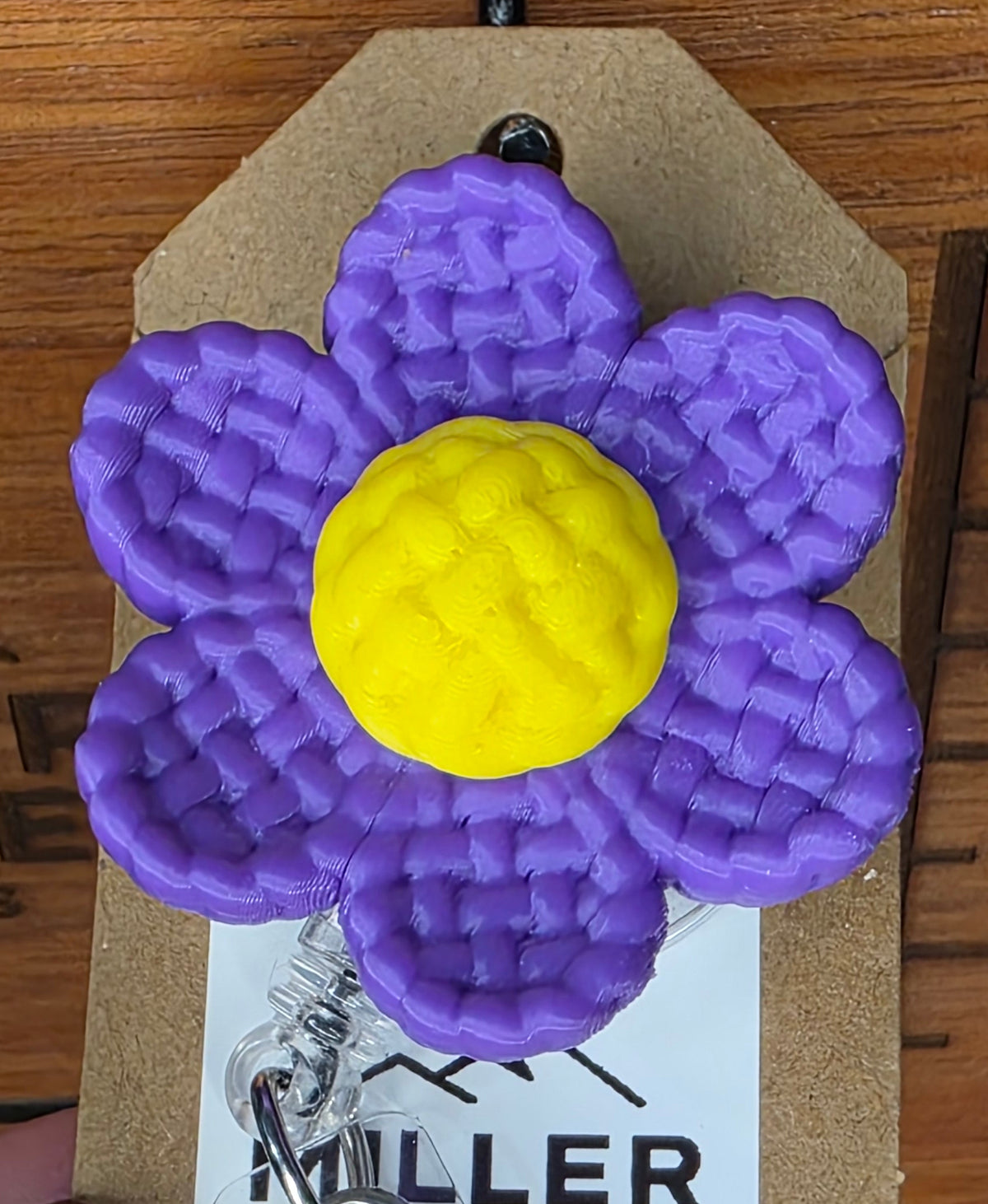 Purple daisy badge reel