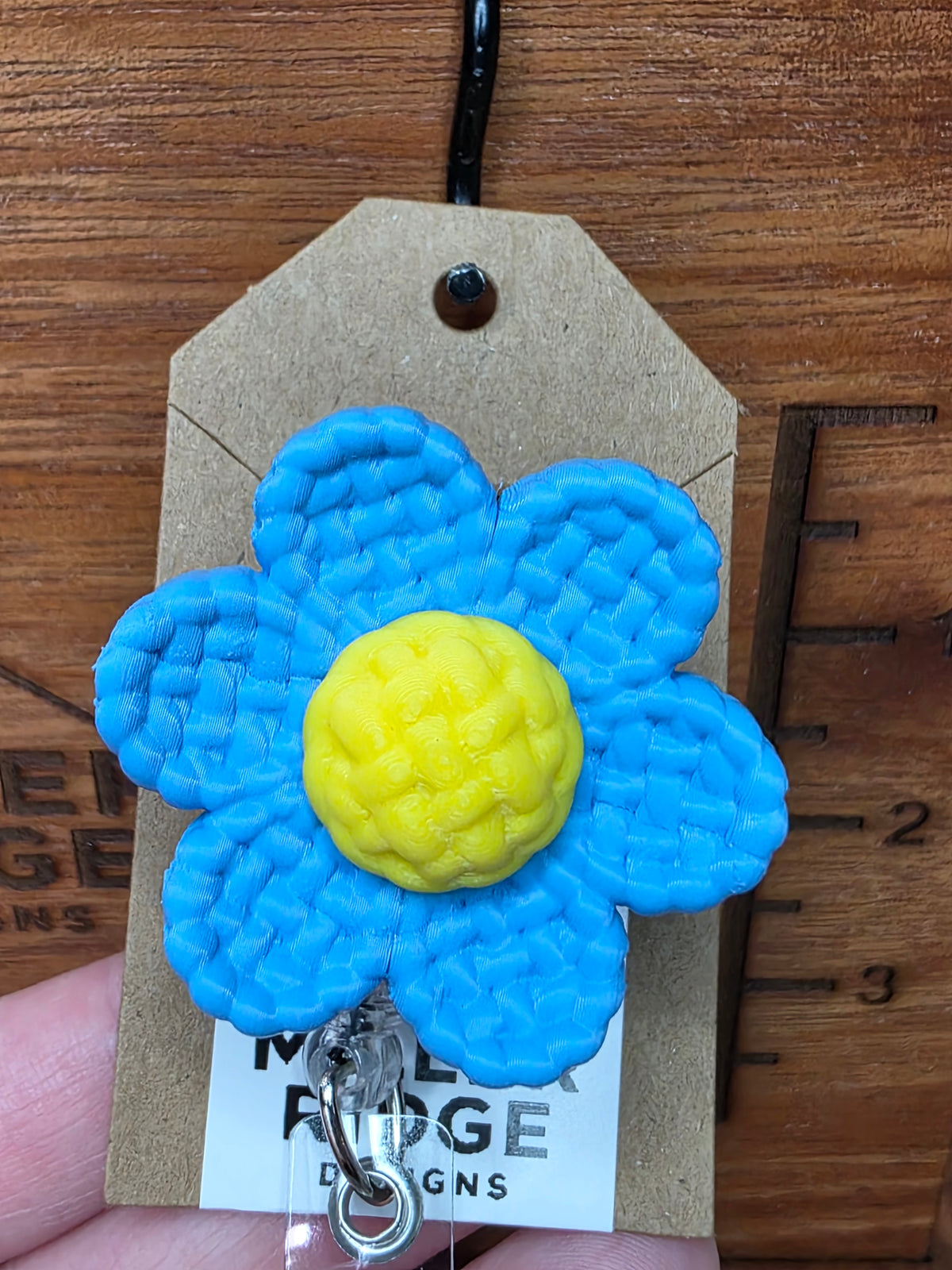 Blue daisy badge reel
